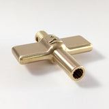 Socket drum made from solid brass by Sonique Drums featuring a brushed and lacquered finish.