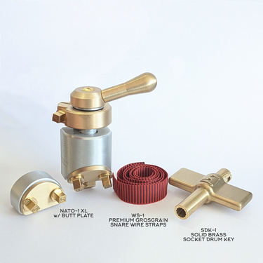 Accessory bundle by Sonique Drums featuring the NATO-1 XL throw off in brass with a set of Poly Pro snare wire straps and the socket drum key.