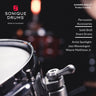 Sonique Drums Summer 2026/27 Product Catalog cover featuring a close-up of a snare drum hardware component, with text listing Percussion Accessories, Solid Shell Snare Drums, and Artist Spotlight: Jazz Waveologist - Wayne Matthews Jr.